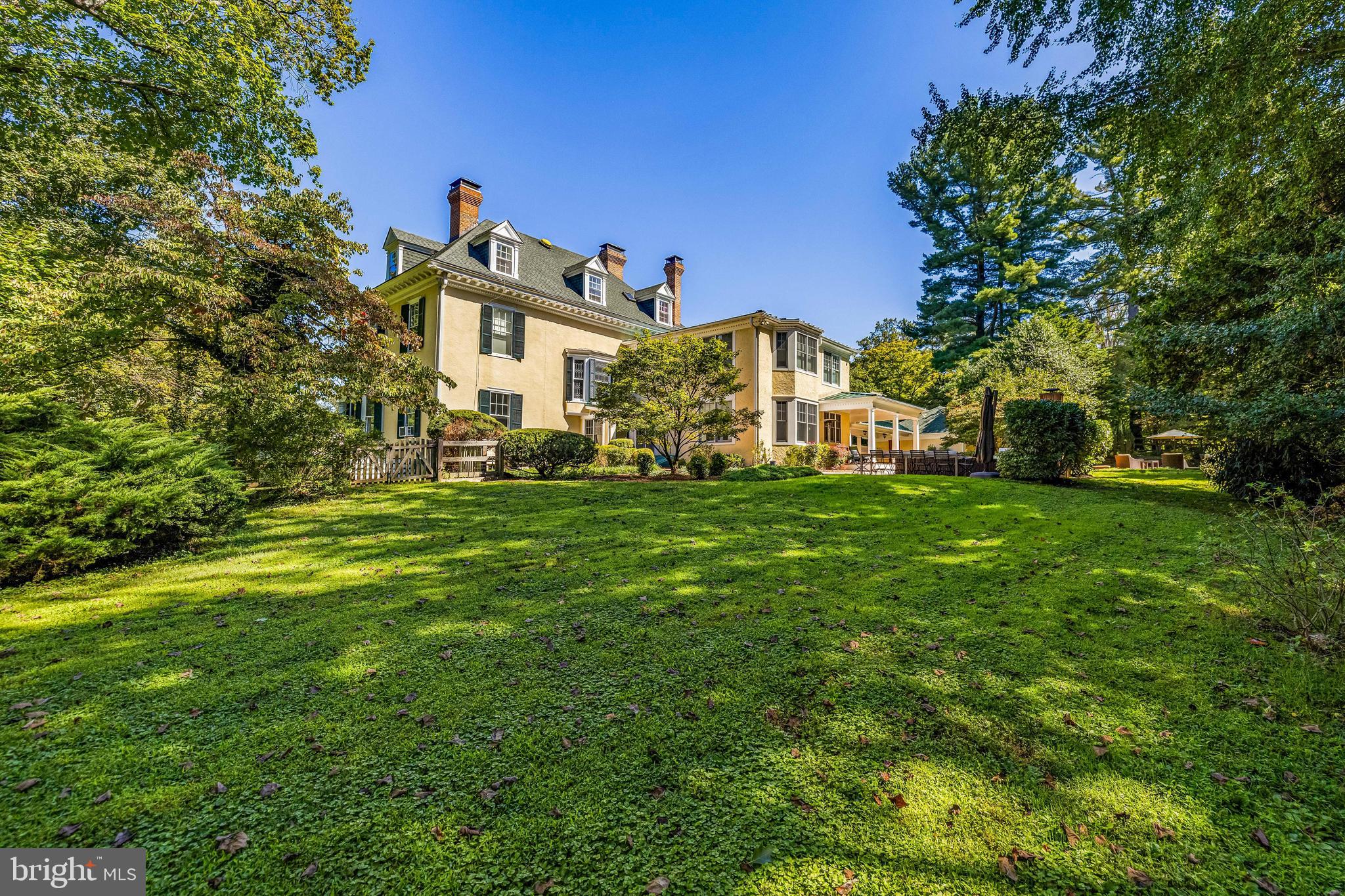 1926 Ruxton Road Ruxton, MD 21204 - Photo 95 of 108 a big white house with a big yard and large trees