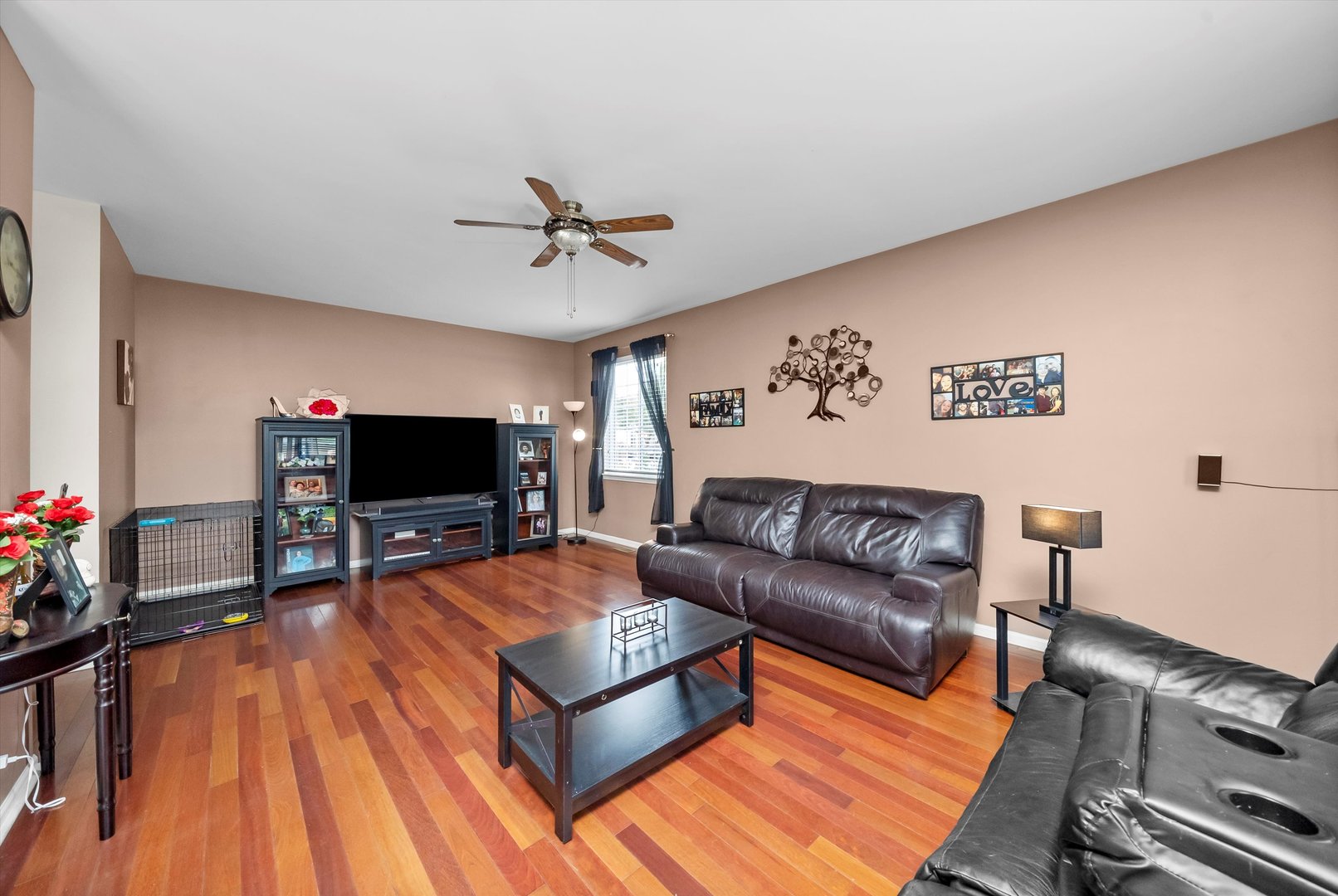 615 Silver Leaf Drive Joliet, IL 60431 - Photo 3 of 34 a living room with furniture and a flat screen tv