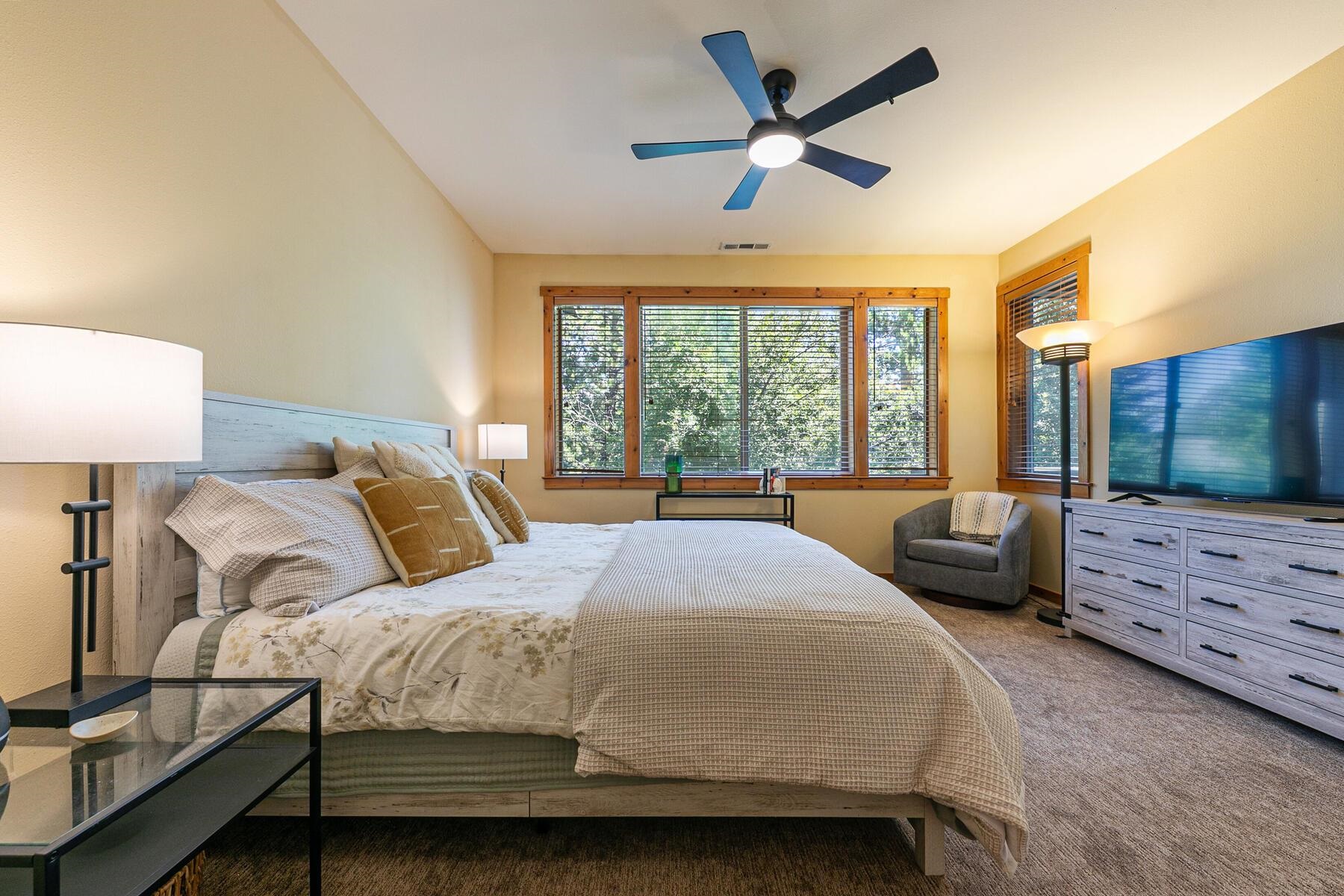 10903 Cinnabar Way, Unit 4 Truckee, CA 96161 - Photo 15 of 28 a bedroom with a large bed and a large window