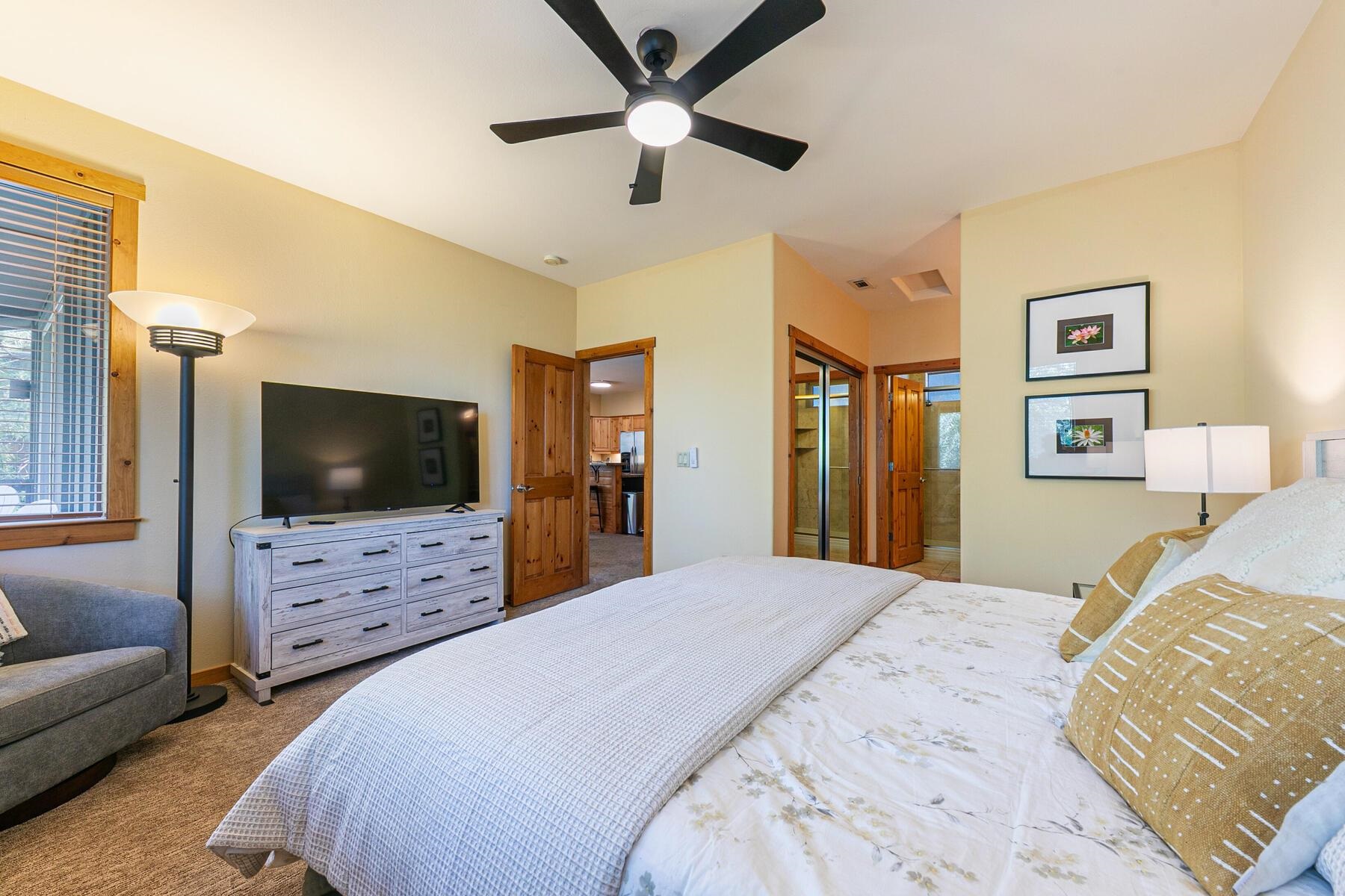 10903 Cinnabar Way, Unit 4 Truckee, CA 96161 - Photo 16 of 28 a bedroom with a bed a flat screen tv and dresser