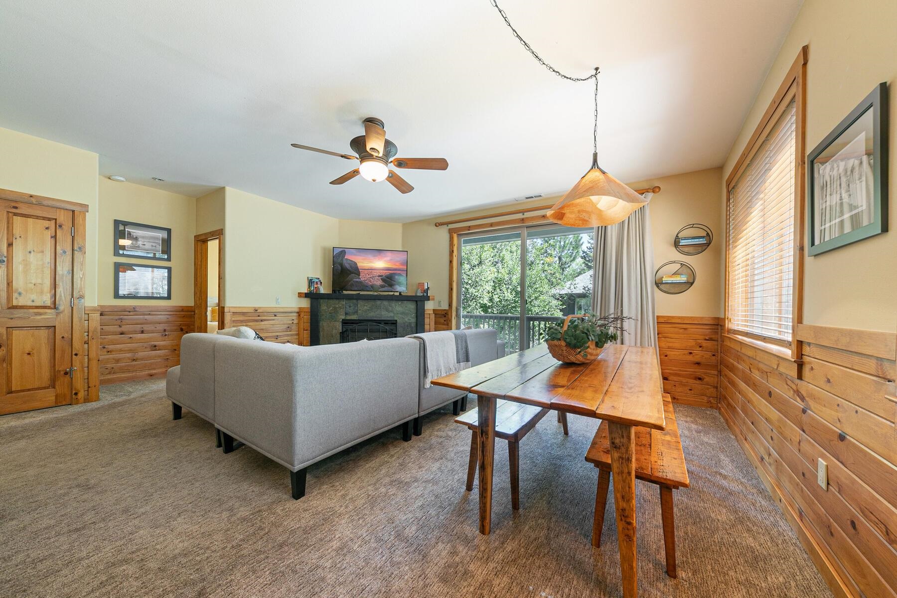 10903 Cinnabar Way, Unit 4 Truckee, CA 96161 - Photo 10 of 28 a living room with fireplace furniture and a large window