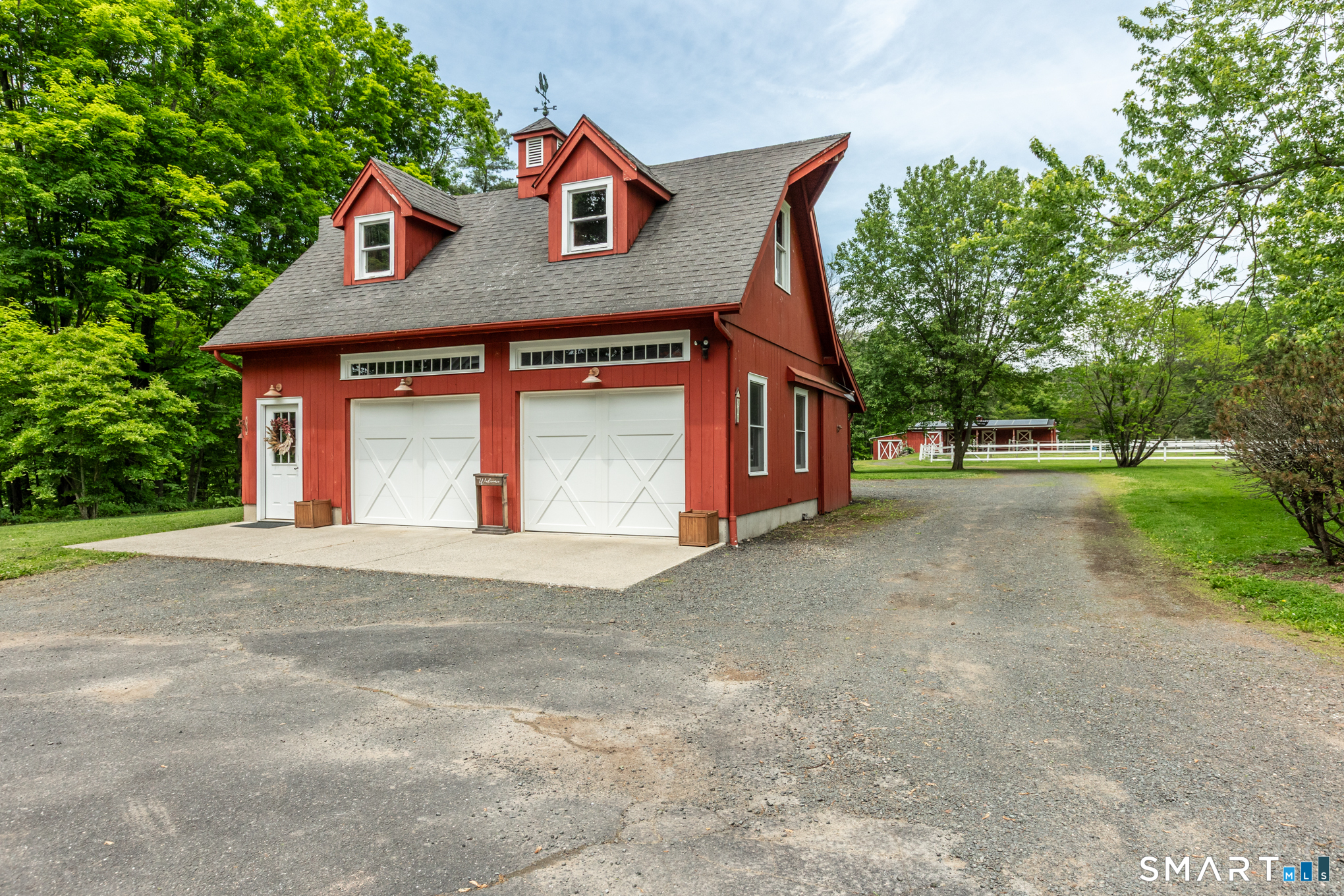 808 Branch Road Suffield, CT 06078 - Photo 29 of 40 a front view of a house with a yard and garage