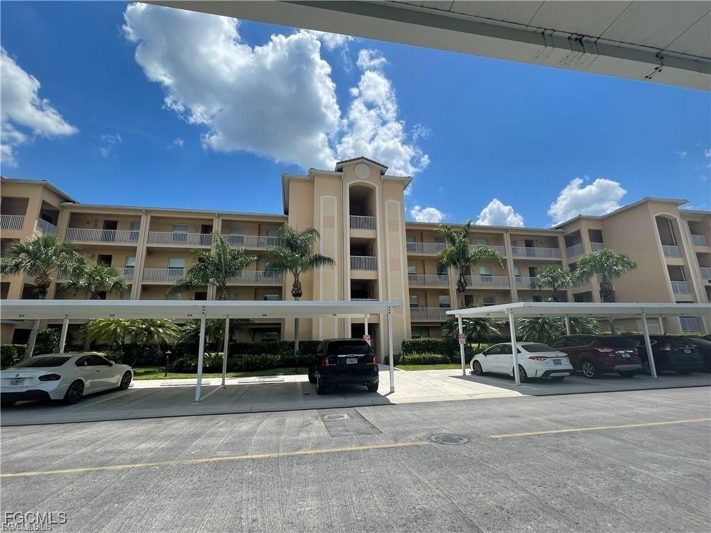 8550 Kingbird Loop, Unit 635 Estero, FL 33967 - Photo 11 of 12 a view of a patio with table and chairs and potted plants