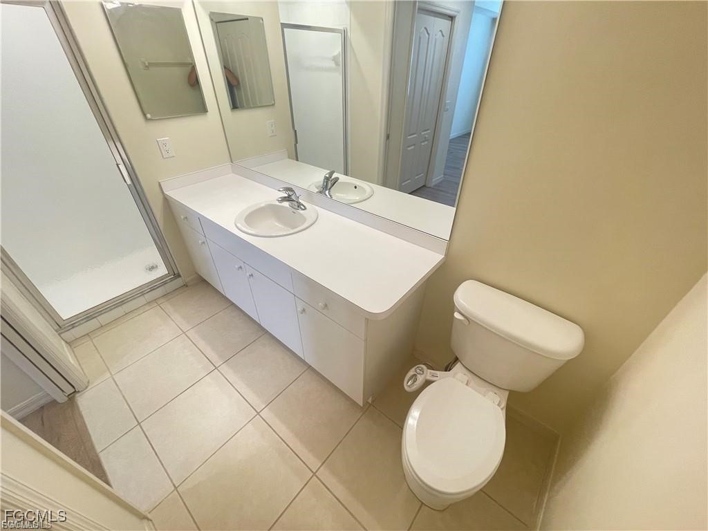 8550 Kingbird Loop, Unit 635 Estero, FL 33967 - Photo 8 of 12 a bathroom with a toilet sink and mirror