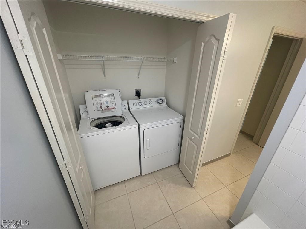 8550 Kingbird Loop, Unit 635 Estero, FL 33967 - Photo 9 of 12 a utility room with dryer and washer