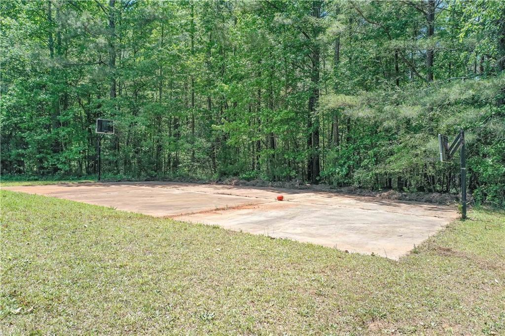 7387 Milam Road Winston, GA 30187 - Photo 40 of 41 a view of swimming pool with an outdoor space and seating area