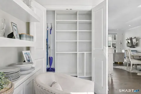 a living room with a couch and a table with wooden floor