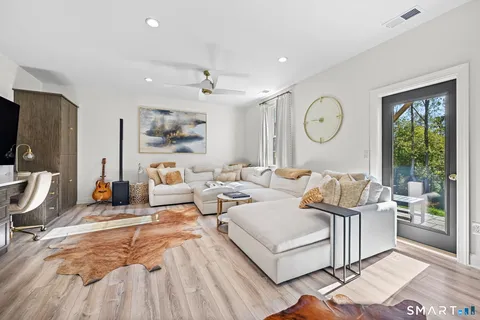 a living room with furniture and a large window