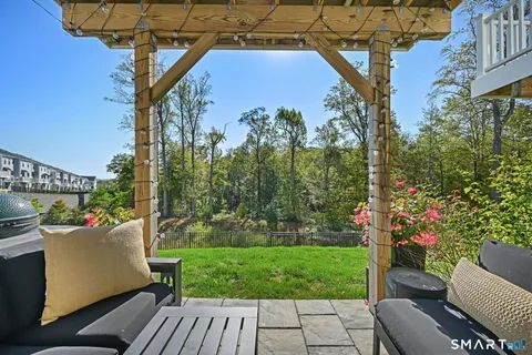 a view of a patio with a table and chairs