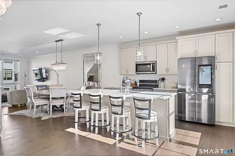 a kitchen with appliances a counter space and a center island