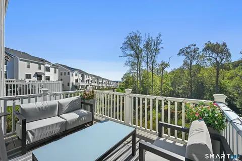 a view of a balcony with furniture