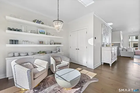 a living room with furniture and kitchen view