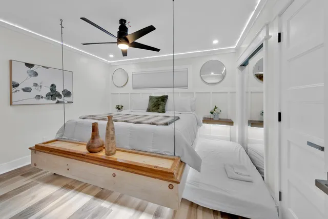 a living room with furniture and a clock