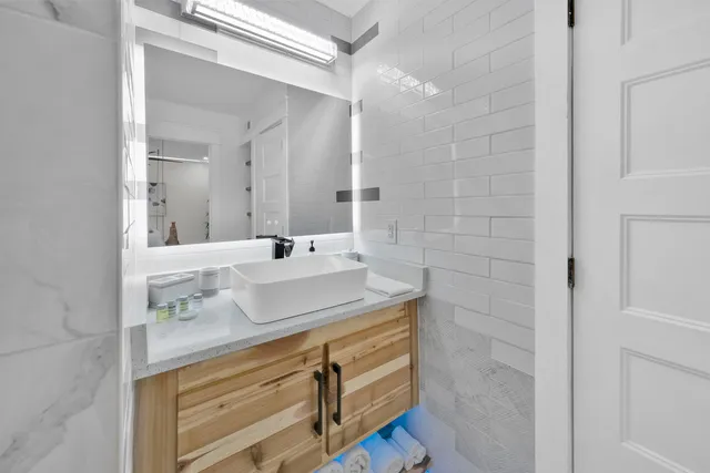a bathroom with a sink and a mirror