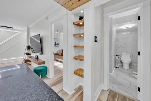 a bathroom with a sink toilet and shower