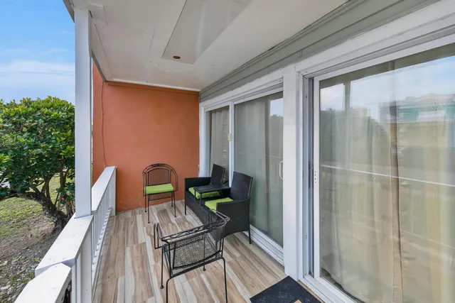 a view of balcony with furniture