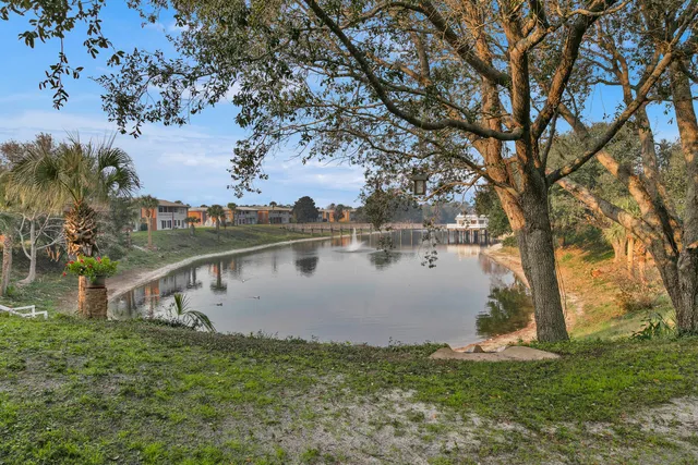 a view of a lake with houses in the back