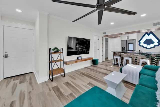 a living room with furniture and a flat screen tv