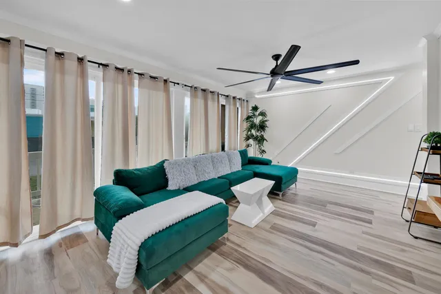 a living room with furniture and a large window