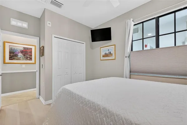 a kitchen with sink cabinets and living room view