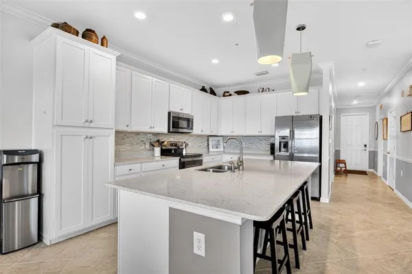 a view of a dining room with furniture and a flat screen tv
