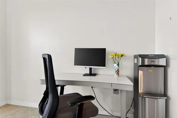 a view of a chairs and table in the balcony