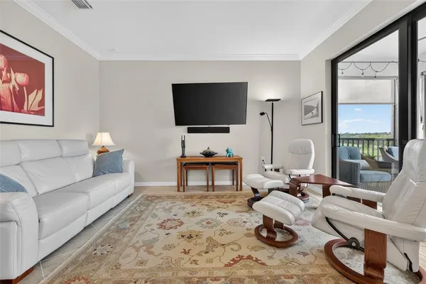 an aerial view of house with yard swimming pool and ocean view