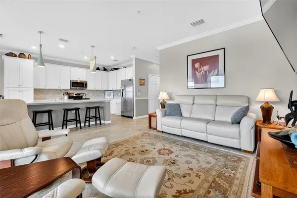 a view of a house with a yard and sitting area