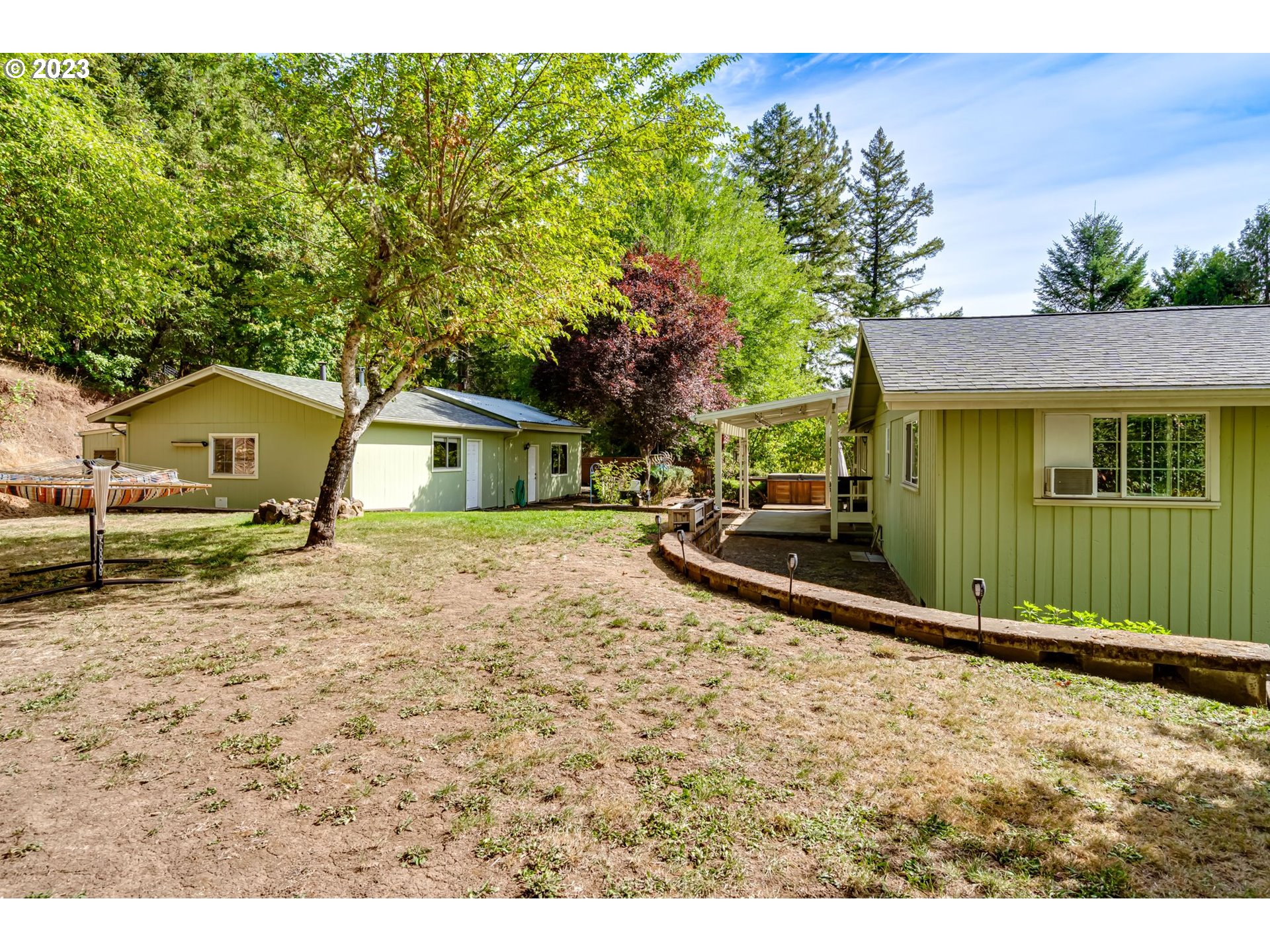 82277 Rattlesnake Road Dexter, OR 97431 - Photo 12 of 42 a house view with a backyard space