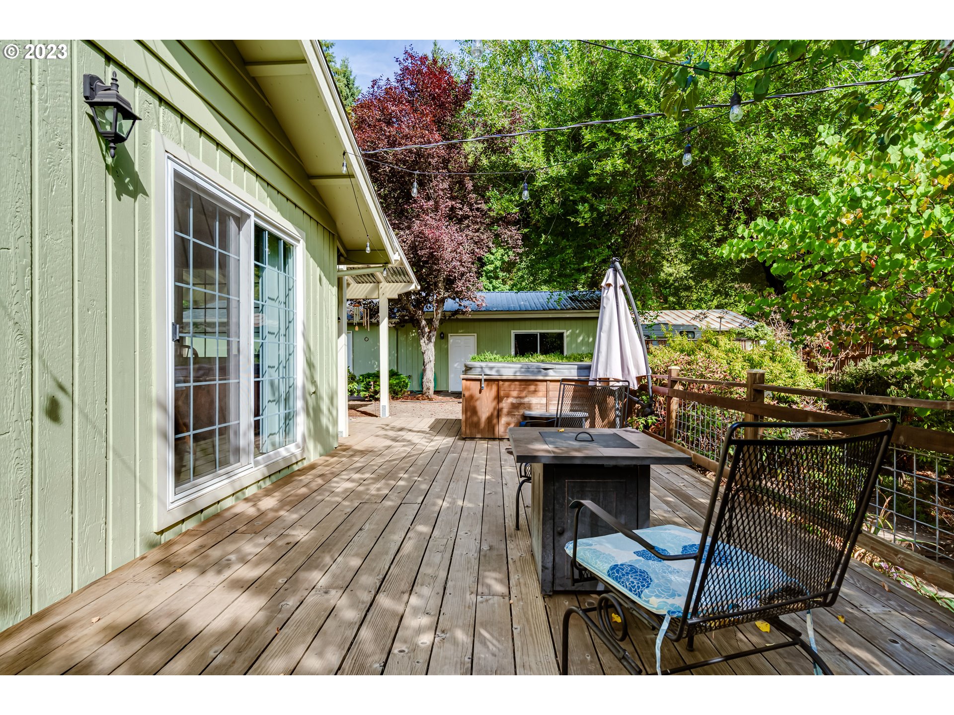 82277 Rattlesnake Road Dexter, OR 97431 - Photo 10 of 42 a view of a patio with table and chairs and potted plants