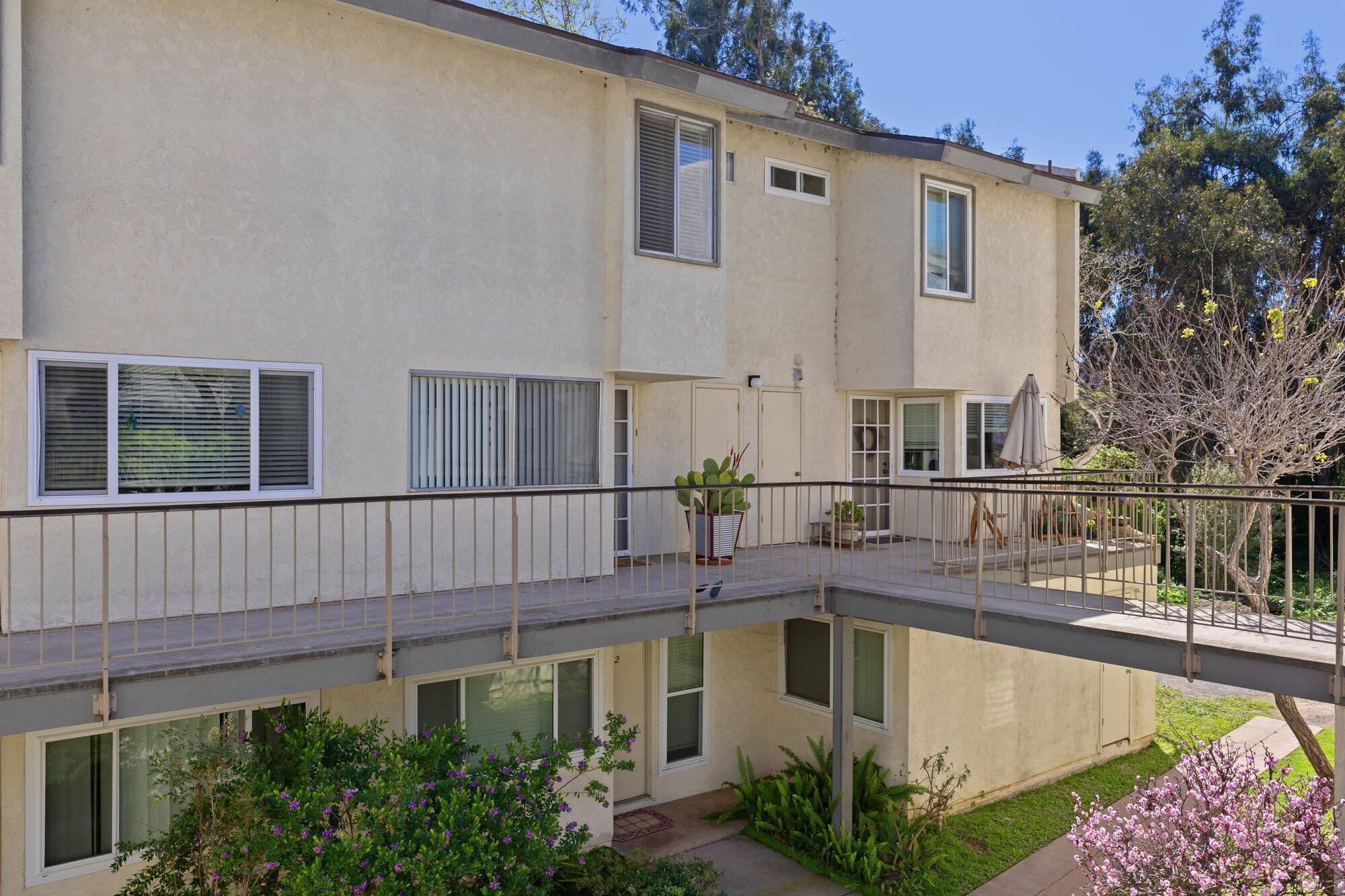 5455 8th Street, Unit 58 Carpinteria, CA 93013 - Photo 11 of 38 a view of a house with pool and chairs