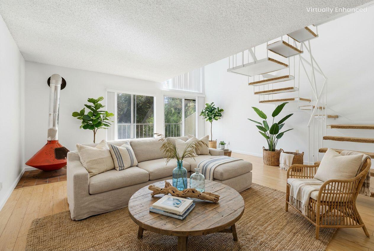5455 8th Street, Unit 58 Carpinteria, CA 93013 - Photo 2 of 38 a living room with furniture and a potted plant