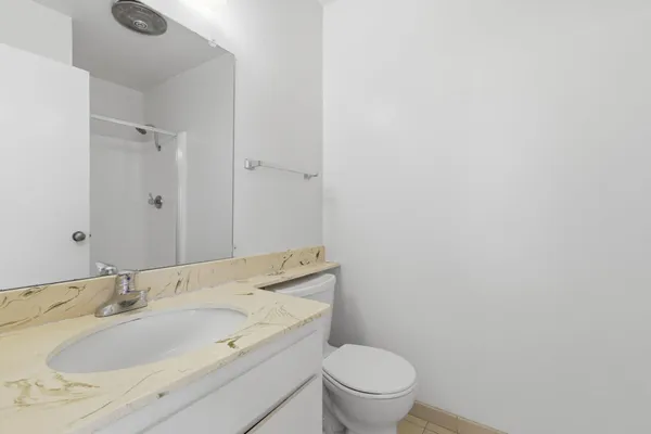 a bath room with a sink and a toilet
