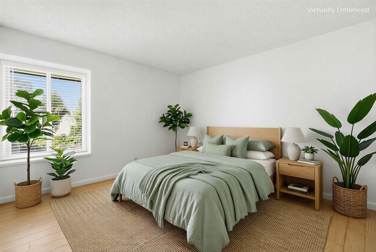 5455 8th Street, Unit 58 Carpinteria, CA 93013 - Photo 5 of 38 a bedroom with bed and a potted plant