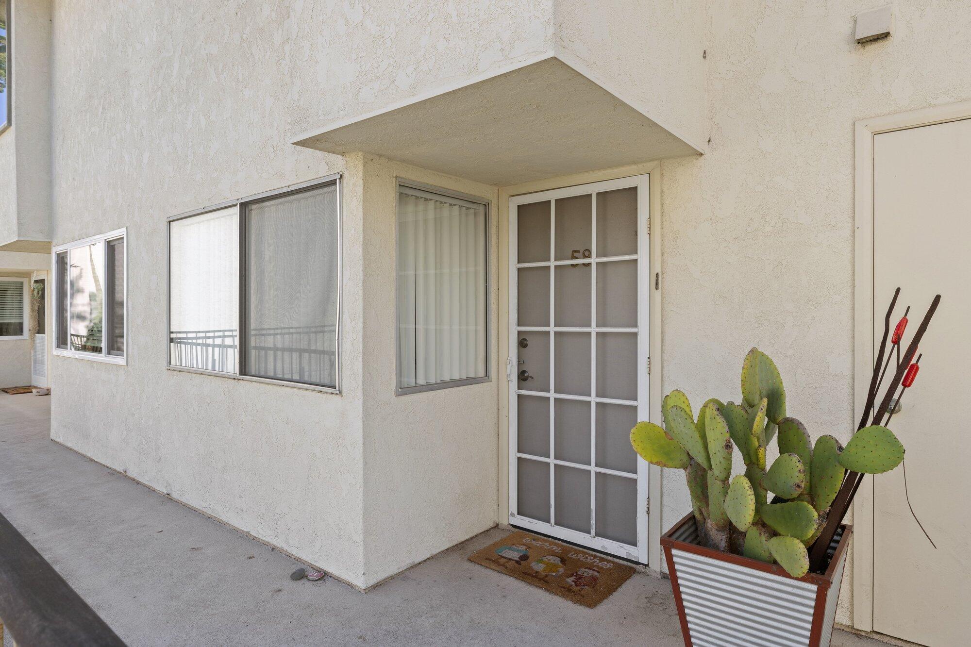 5455 8th Street, Unit 58 Carpinteria, CA 93013 - Photo 9 of 38 a view of a potted plant in front of a house