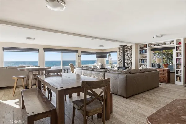 a large kitchen with a table and chairs