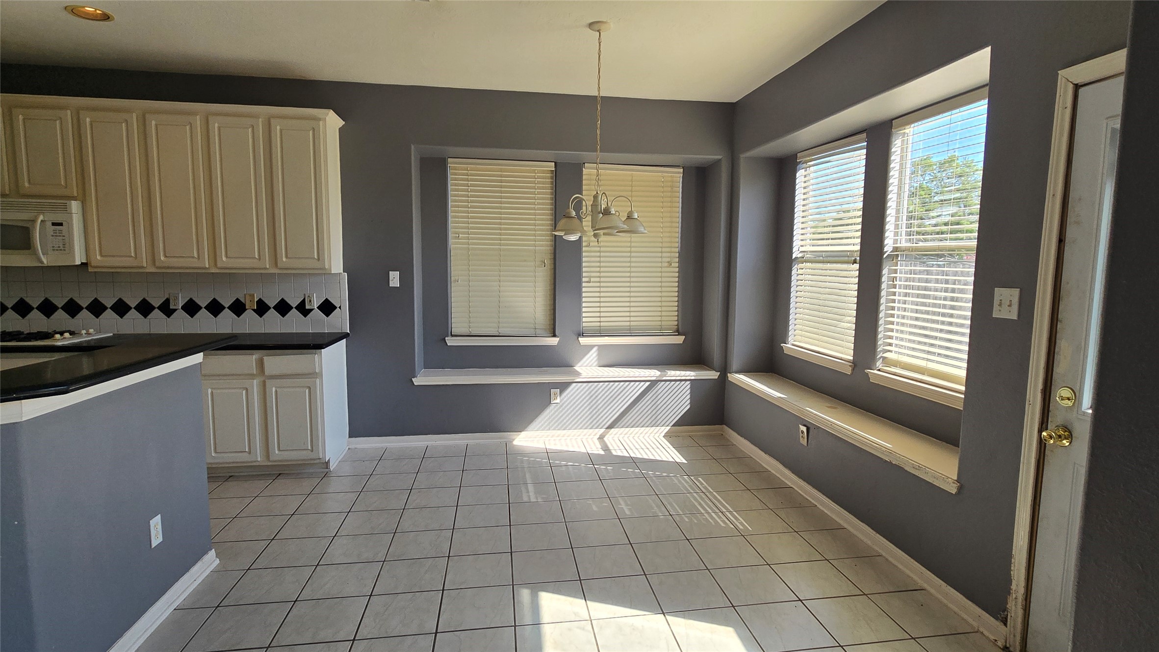 131 Annes Way Stafford, TX 77477 - Photo 7 of 25 a view of a kitchen with a sink and a window