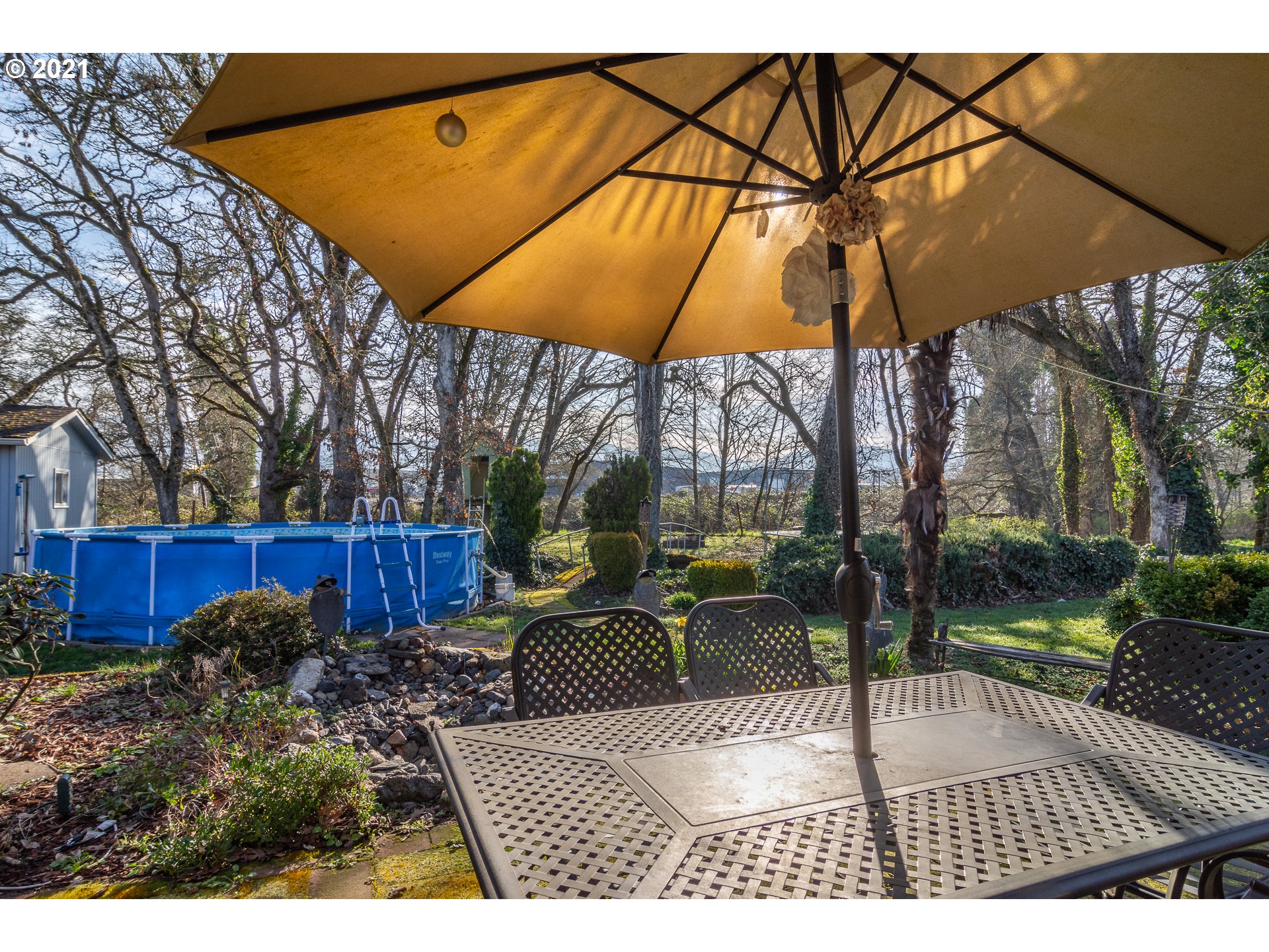 4105 Carnes Road Roseburg, OR 97471 - Photo 31 of 32 a view of backyard with table and chair under an umbrella