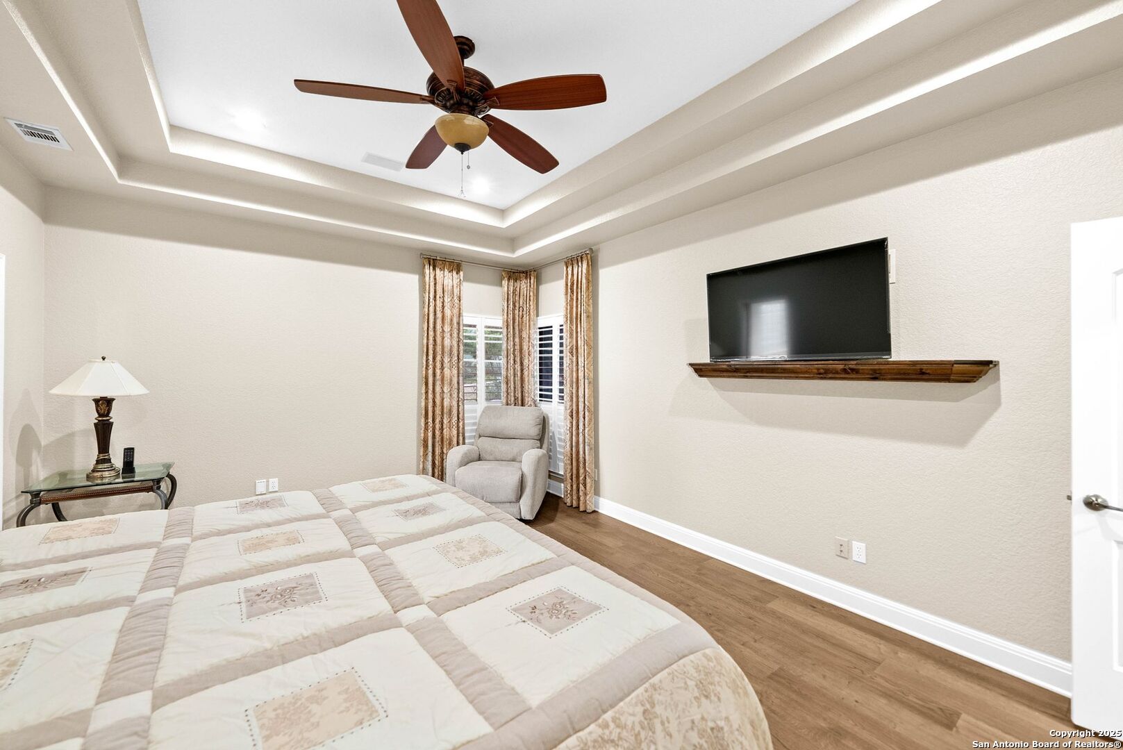 15921 Reyes Ridge Helotes, TX 78023 - Photo 17 of 68 a bedroom with a bed and a flat screen tv