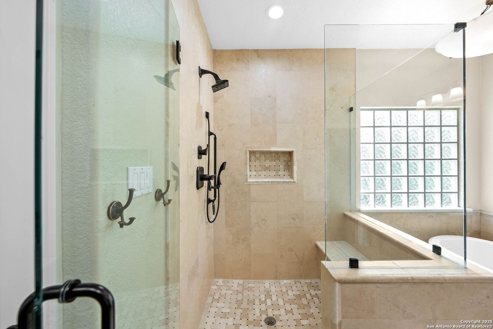 15921 Reyes Ridge Helotes, TX 78023 - Photo 21 of 68 a bathroom with a bathtub and shower