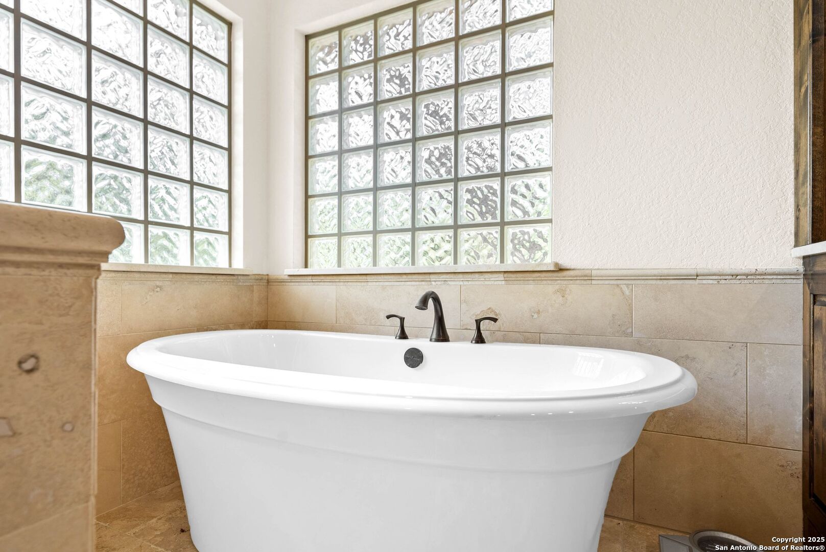 15921 Reyes Ridge Helotes, TX 78023 - Photo 22 of 68 a bathroom with a sink and a window