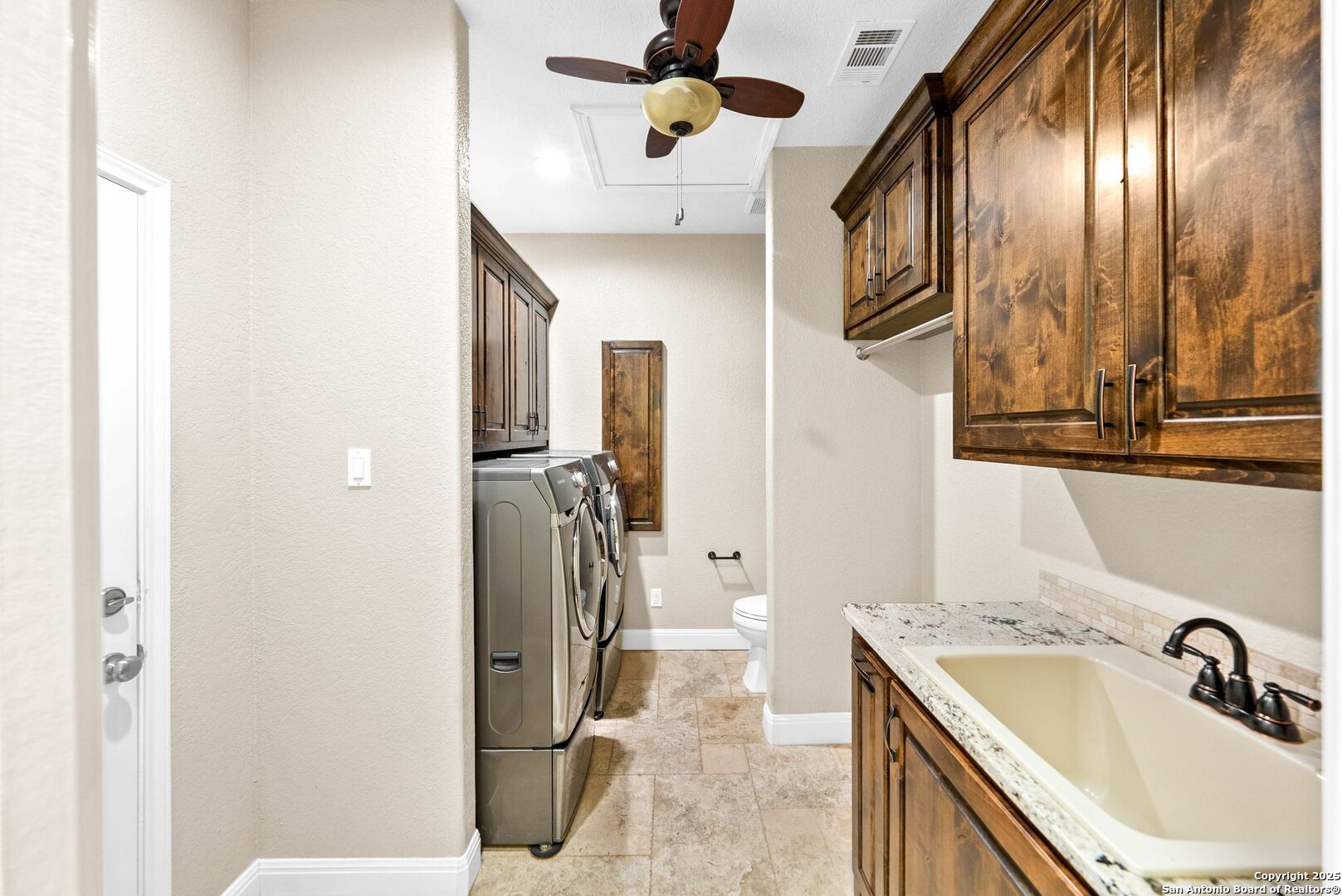 15921 Reyes Ridge Helotes, TX 78023 - Photo 25 of 68 a bathroom with a sink and a mirror