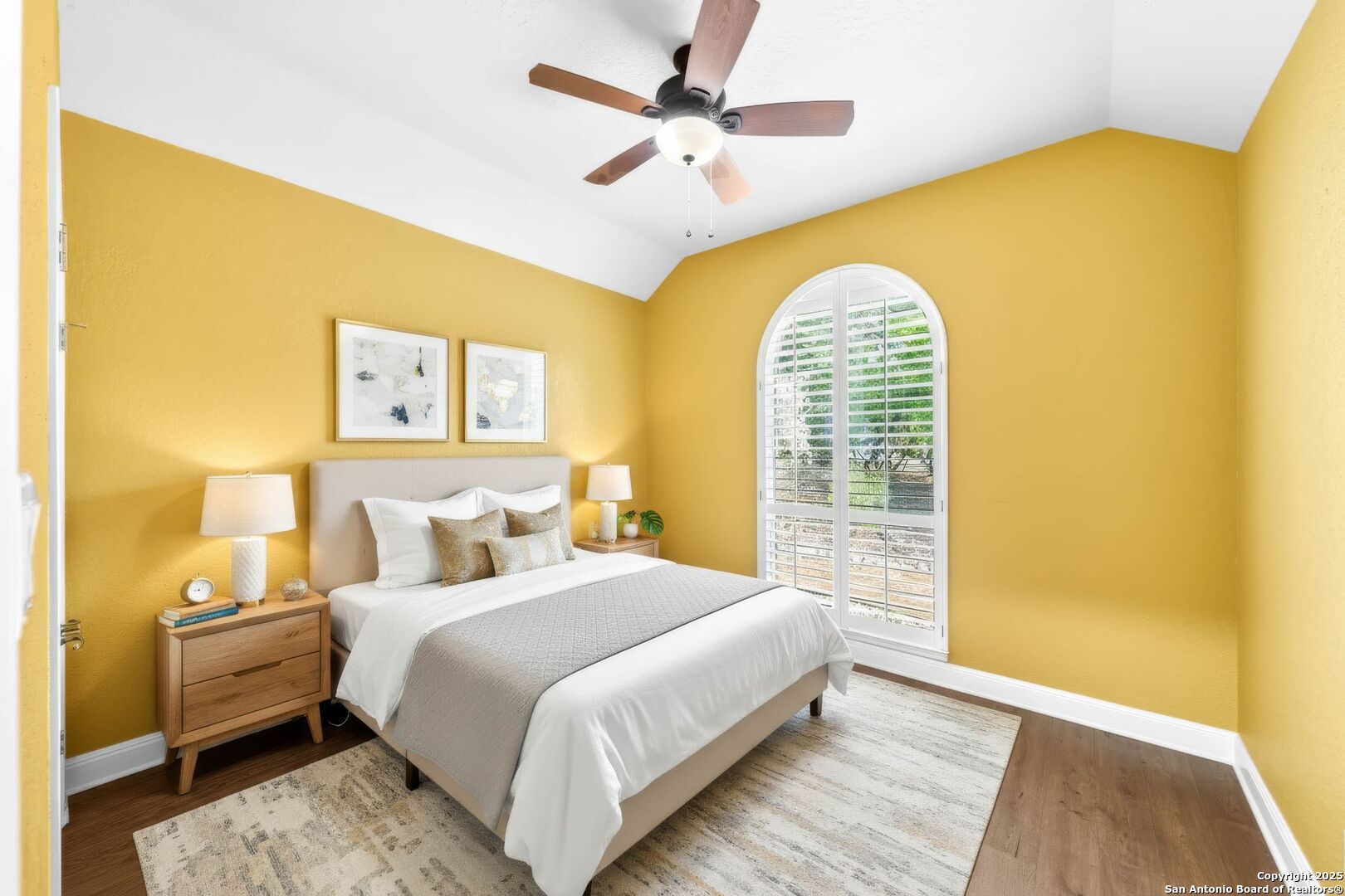 15921 Reyes Ridge Helotes, TX 78023 - Photo 33 of 68 a bedroom with a bed and a chandelier