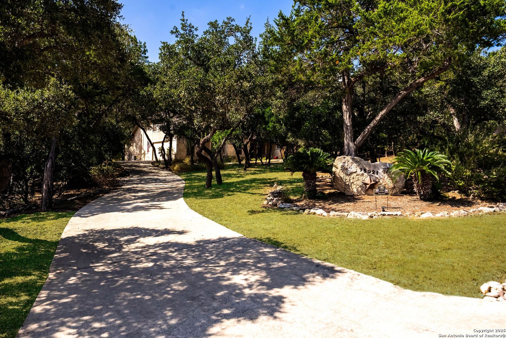 15921 Reyes Ridge Helotes, TX 78023 - Photo 4 of 68 a view of a swimming pool with an outdoor space and seating area