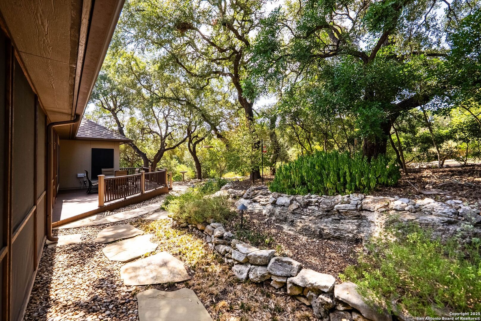 15921 Reyes Ridge Helotes, TX 78023 - Photo 43 of 68 a view of a house with a tree back yard