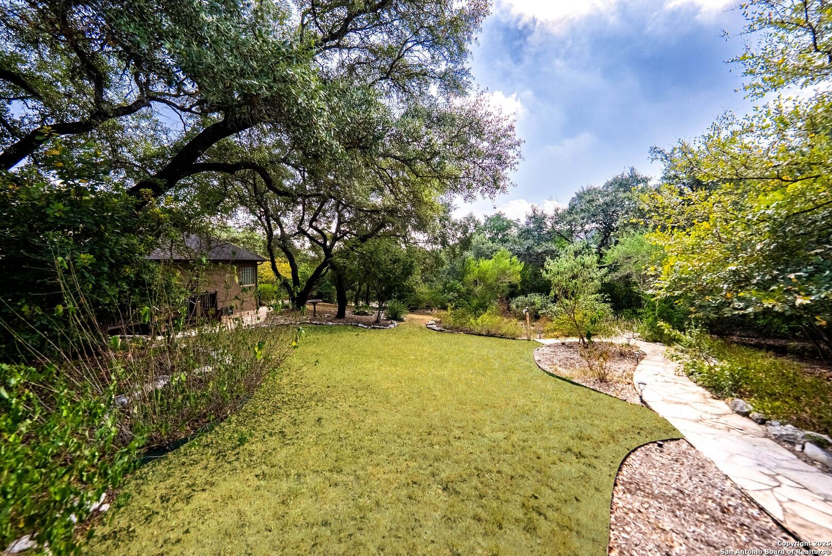 15921 Reyes Ridge Helotes, TX 78023 - Photo 46 of 68 a view of a swimming pool with a yard