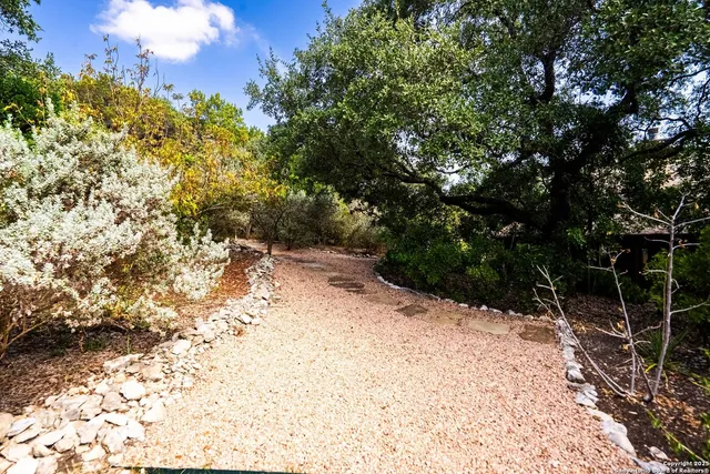 an aerial view of residential houses with outdoor space and swimming pool