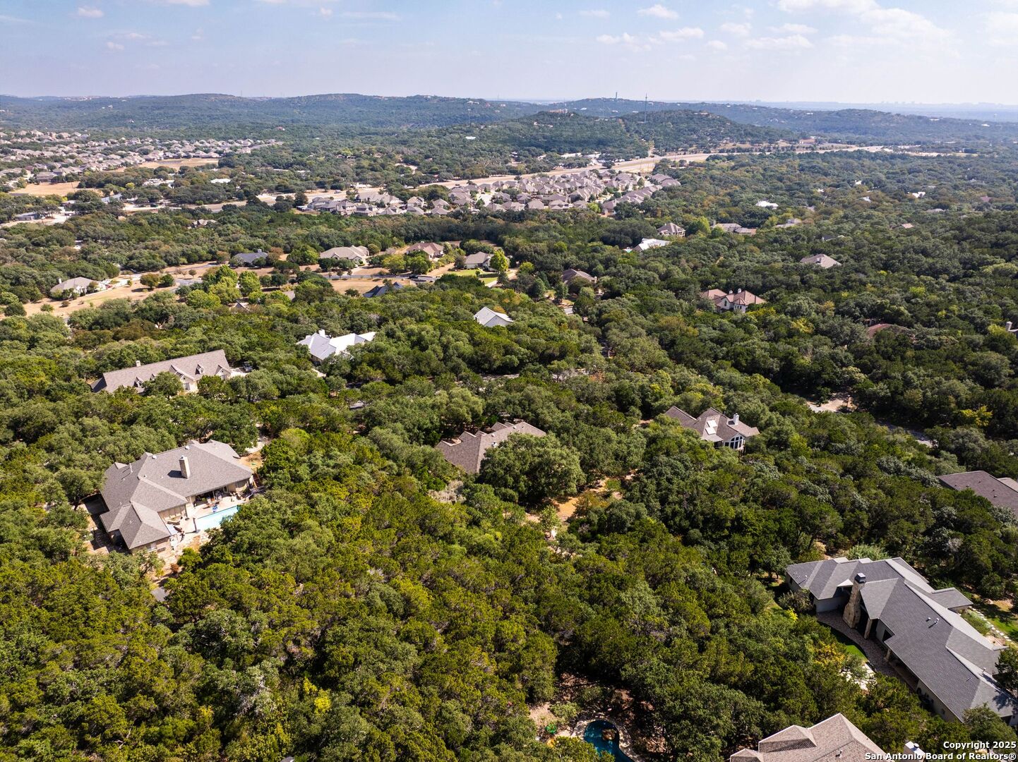15921 Reyes Ridge Helotes, TX 78023 - Photo 62 of 68 an aerial view of a city with lots of residential buildings