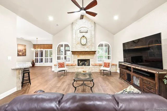 a dining room with furniture window and wooden floor