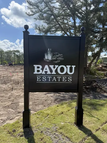 a sign on the side of a tree